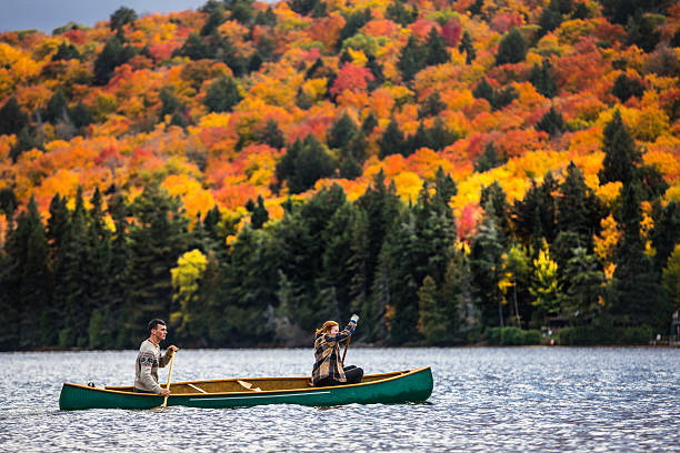 istock Couple enjoying a ride on a typical canoe in Canada 621244182