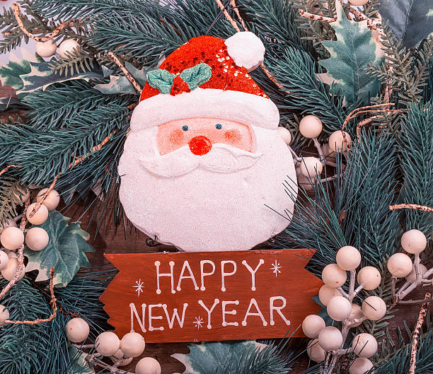 istock happy new year written on wooden background 621244222