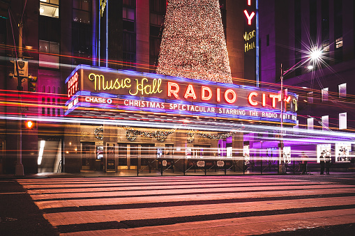 New York City, NY, USA - November 4, 2016: Radio City Music Hall long exposure on 6th Avenue.