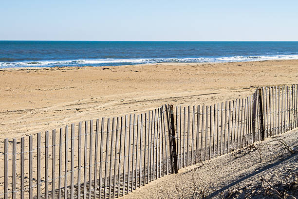 istock Picket Fence on Empty Sandbridge Beach in Virgnia 621245604