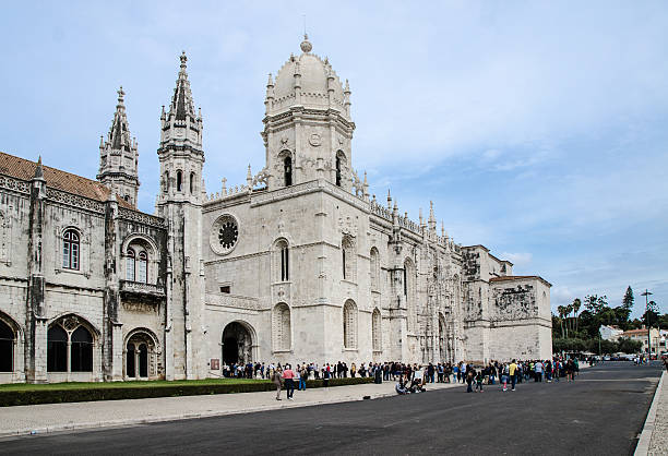 Jeronimos Monastery of Belem (Mosteiro dos Jeronimos) with huge crowd in line to enter during day of autumn