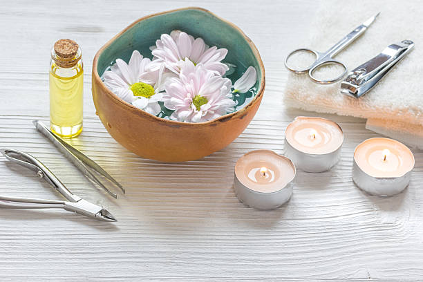 istock spa nail care with tea candle on wooden background 621246828