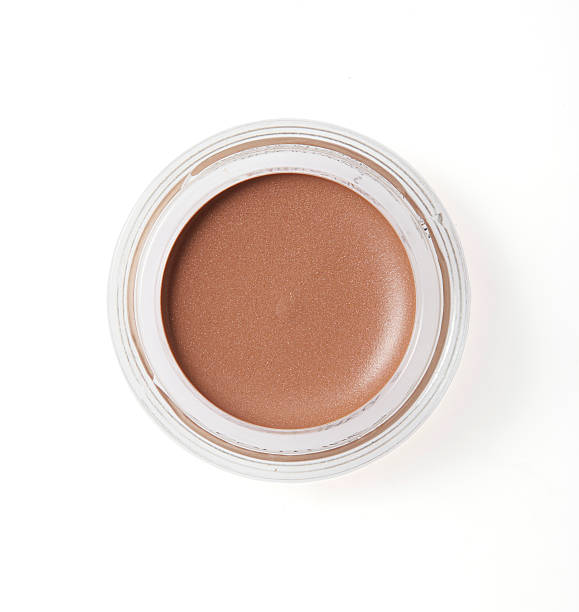 istock Brown color cheek make up in round container on background 621247274