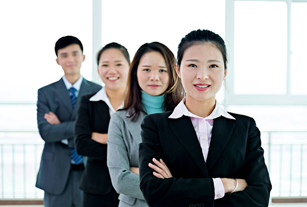 istock Group of businesspeople standing in a line 621248408