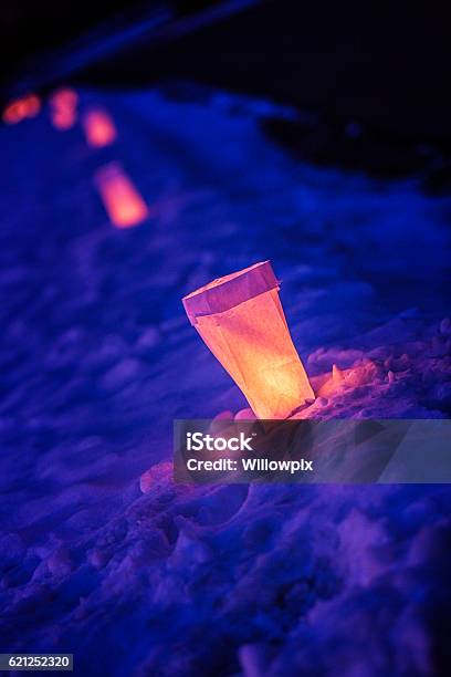Christmas Candle Illuminated Paper Bag Luminary Lanterns Lining Neighborhood Street Stock Photo - Download Image Now