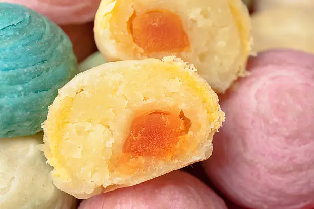 Chinese ancient dessert called 'Pia',ancient dessert Made from flour to Baking heat Mashed golden beans stuffed with salted egg yolk,Chinese pastry, Traditional delicious moon cake in asia,pastel color