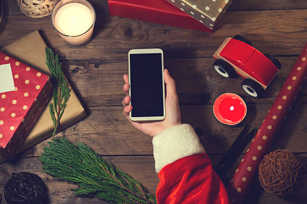 istock Santa use smart phone with a copyspace for Christmas.Chr 621252852