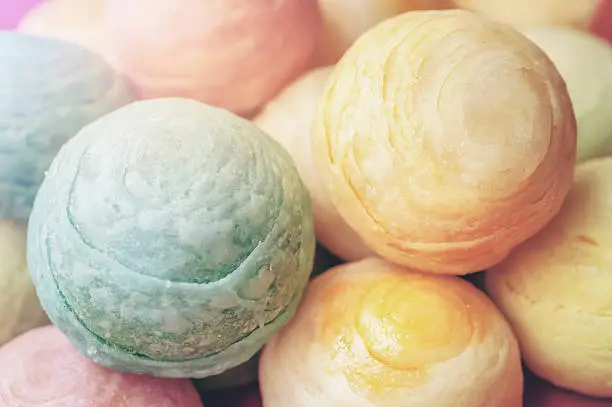 Chinese ancient dessert called 'Pia',ancient dessert Made from flour to Baking heat Mashed golden beans stuffed with salted egg yolk,Chinese pastry, Traditional delicious moon cake in asia,pastel color