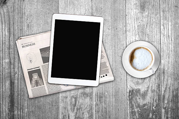 istock Daily newspaper, coffee and tablet with a blank screen. 621255314