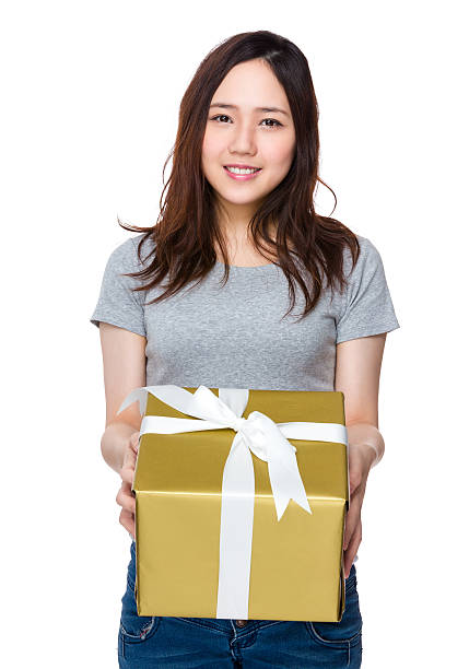 istock Woman holding a gift box 621257514