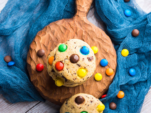 istock Chocolate chip cookies with colorful candies. Top view 621258680
