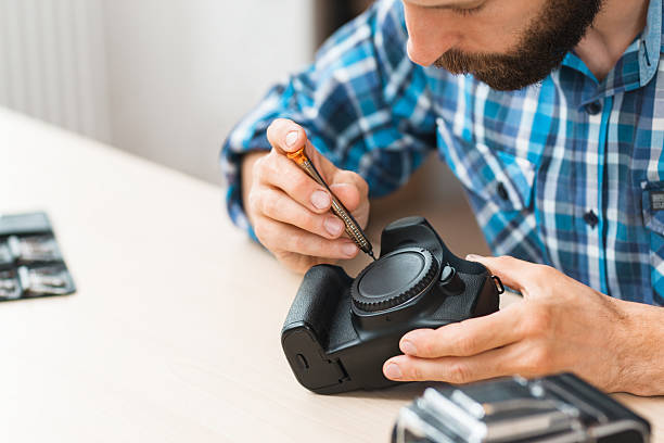 istock Disassembling of photo camera, close-up 621258818