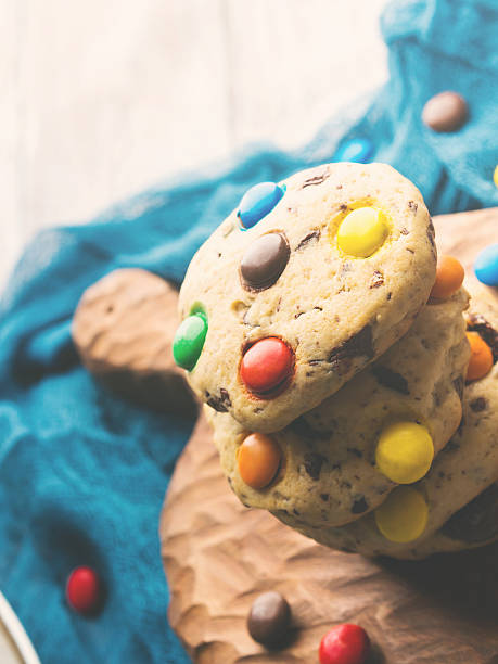 istock Stack of cookies with colorful candies. Vertical 621259160
