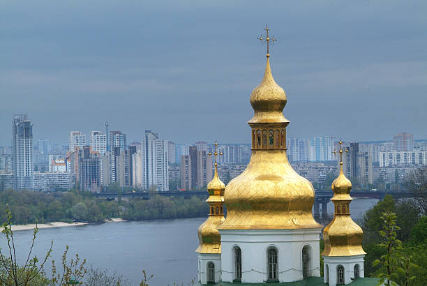 golden bell tower - cross shape built structure building exterior apartment foto e immagini stock