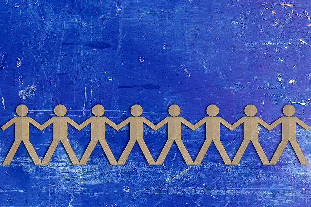 istock Teamwork Concept, Group of People Paper Cut Out 621261840