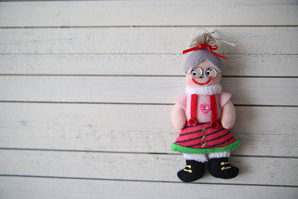 istock grandma's doll rests on a wooden background 621262424