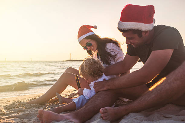 istock Family Christmas time at the beach 621262498