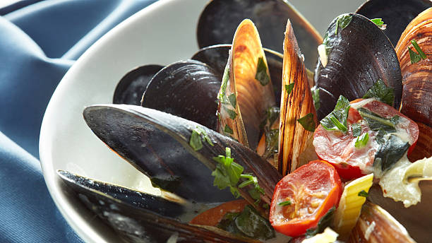 istock Close-up of boiled mussels with lemon 621264718