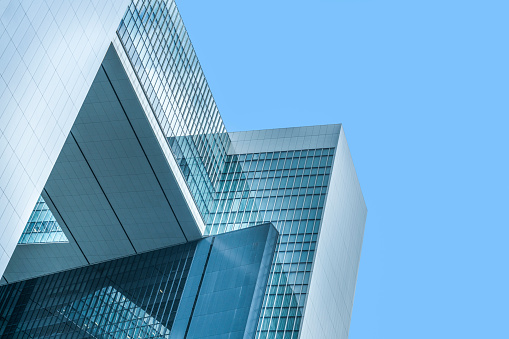 Low angle view of modern office buildings at night, New York City, USA