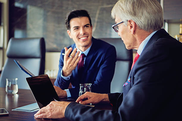 istock Young businessman is talking with his CEO 621267256