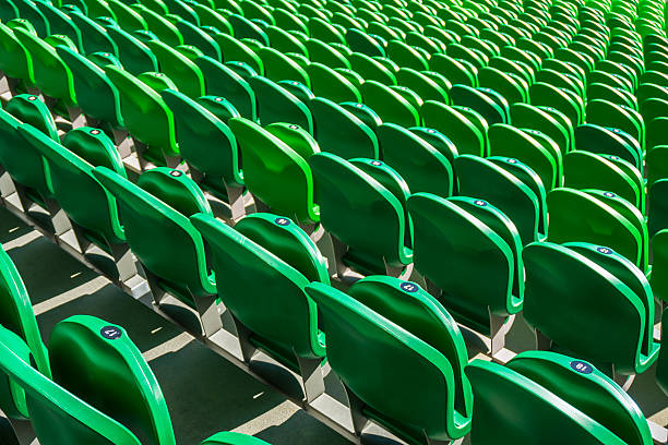 istock Seating rows in a stadium with weathered chairs 621268380
