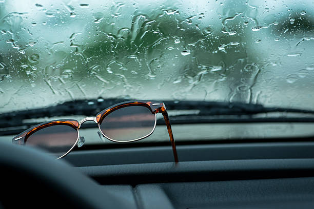 istock Sunglasses on a dashboard of a car 621270192