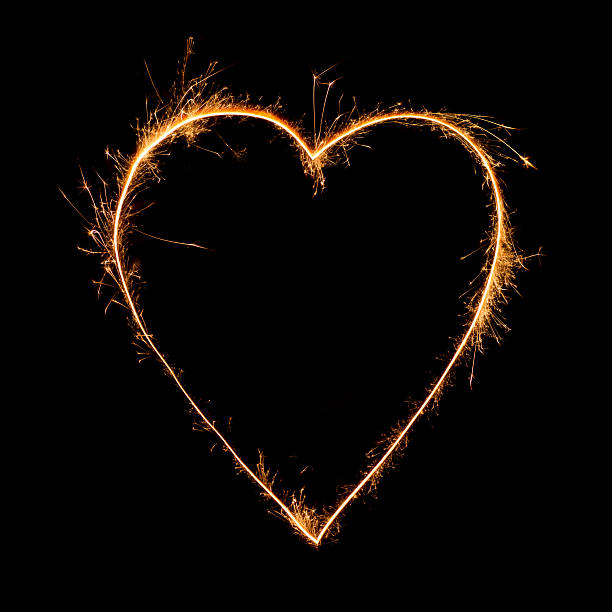 istock Heart of sparkler on black background 621271240