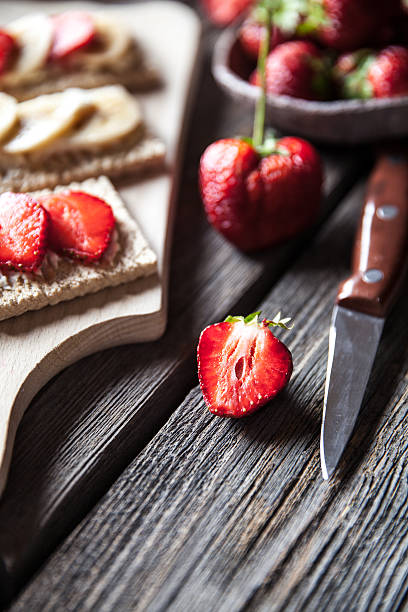 istock Fruity toast on wooden background. Strawberries 621271630