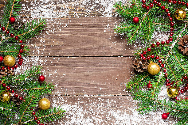 istock christmas fir tree with decoration on wooden board 621272142