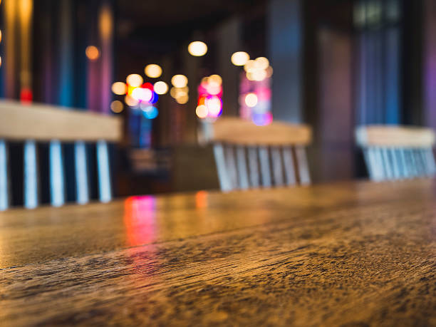 istock Table Bar counter desk Seats Blurred colourful lighting background 621272892