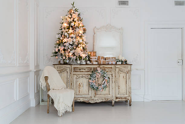 istock Christmas tree on wooden chest of drawers commode bureau in 621274766