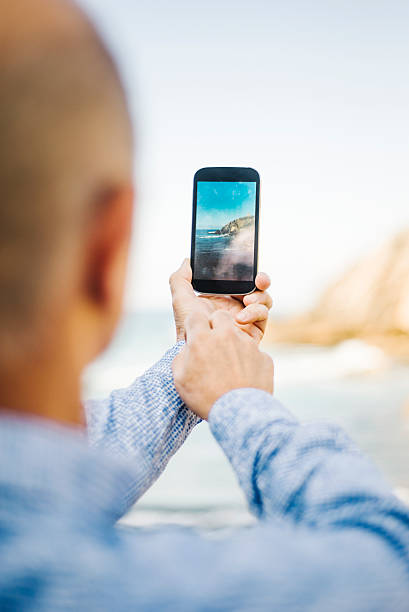 istock Mature man taking a picture 621275278