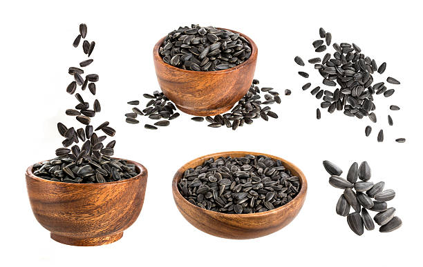 istock Black sunflower seeds isolated on white background 621349156