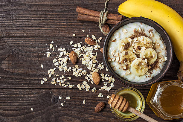 istock oatmeal porridge in ceramic bowl. top view 621349314