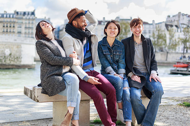istock Multi-ethnic group of friends having fun in Paris along Seine 621349992