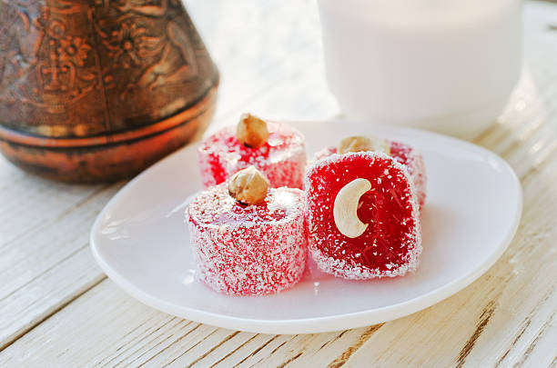 Amber Turkish delight with nuts closeup pots in the background