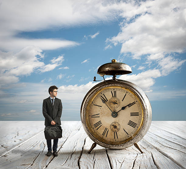 istock Young Businessman and Alarm clock 621351146