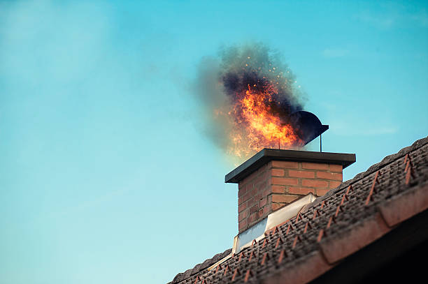 Chimney with a fire coming out Chimney with fire coming out sabotage photos stock pictures, royalty-free photos & images