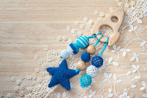 istock Wooden spaceship toy and knitted beads 621352662