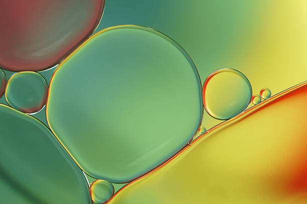 istock Oil drops on water surface - abstract colorful macro (458) 621353118