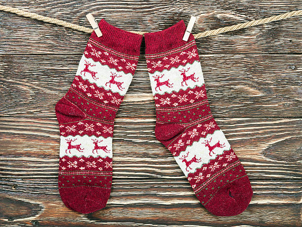 istock Christmas socks hanging on the wooden 621353614