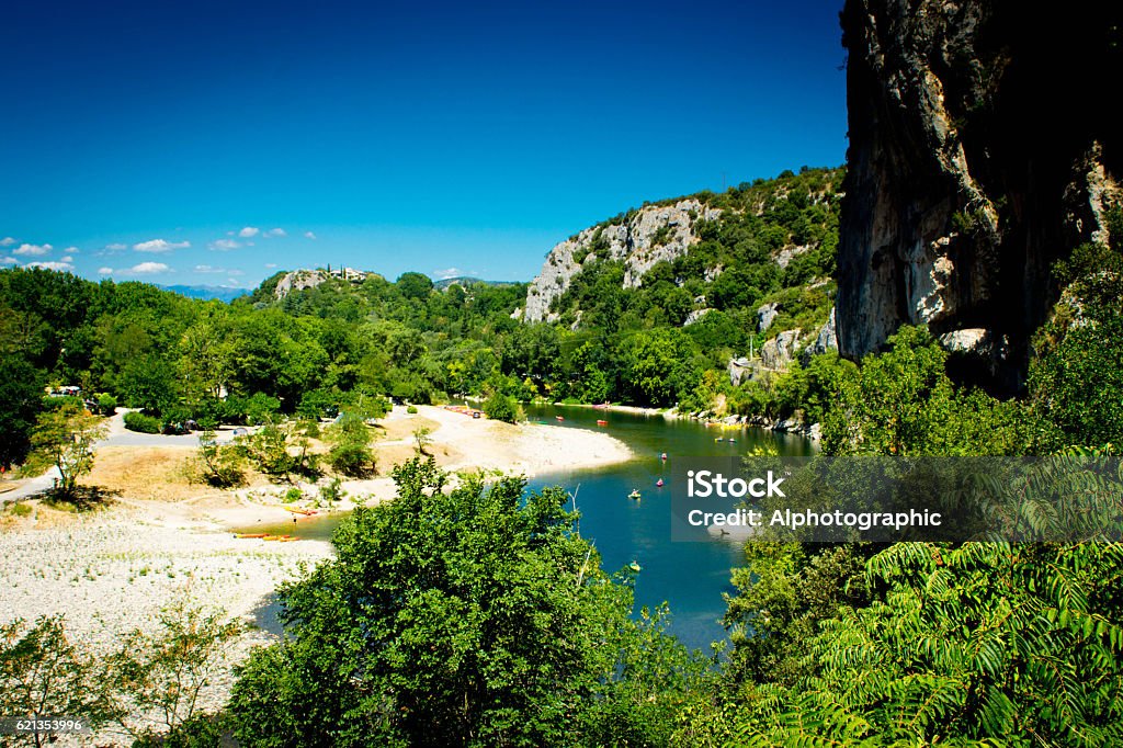 Pont D'Arc Ardeche River Ardeche near the famous natural landmark of the Pont D'Arc with tourists canoeing in the river in the background. Ardeche Stock Photo