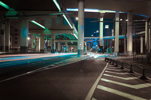 istock Empty road floor with city elevated bridge of night 621355022