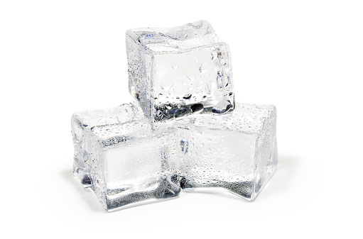 close up of three ice cubes isolated on white background