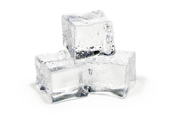 close up of three ice cubes isolated on white close up of three ice cubes isolated on white background ice cube photos stock pictures, royalty-free photos & images