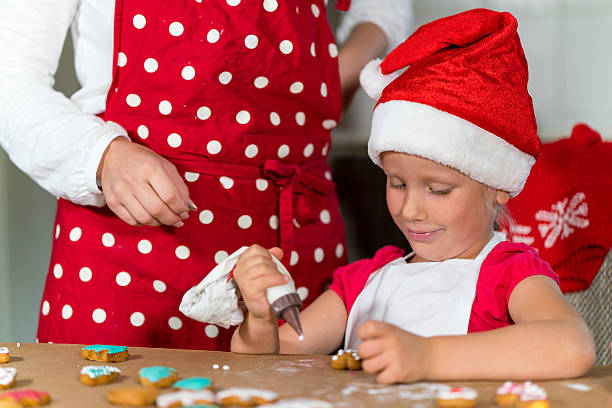 istock Mother and daughter are preparing gingerbread for Christmas 621355772