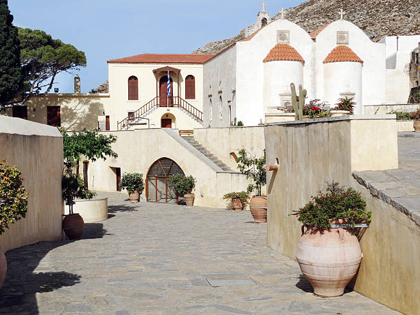 istock traditional old monastery among bougainvillaea in Greece 621356704