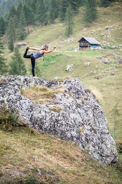 istock Yoga exercises in nature: Dancer pose 621357048