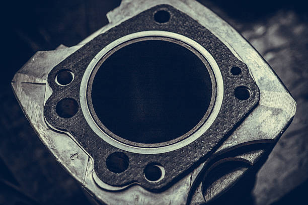 Motorcycle air-cooled cylinder Close up shot of a motorcycle's air-cooled cylinder and gasket. gasket stock pictures, royalty-free photos & images