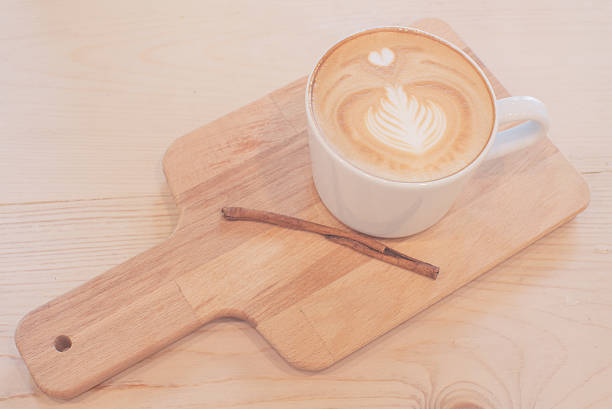 istock latte art coffee in a cup on wood teble 621358206